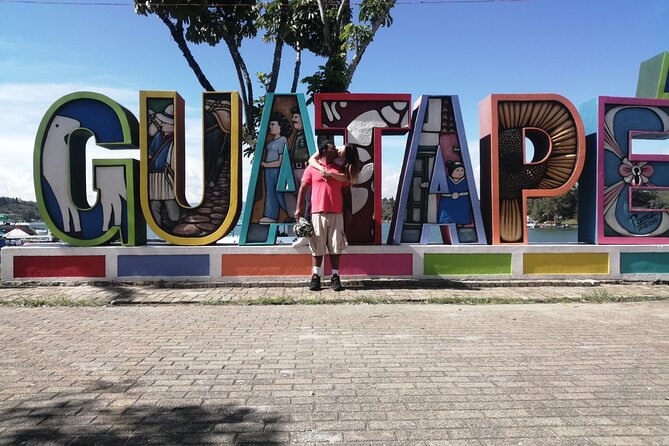Amazing Private Guatape Tour + Boat Ride + Helicopter & Rock - Guatapé’s Malecón and the story behind the colorful walls