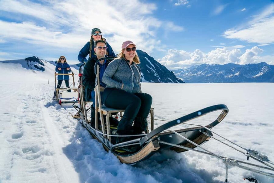 Anchorage Area: Helicopter and Glacier Dogsled Tour - Landing on snow for the dog sled ride