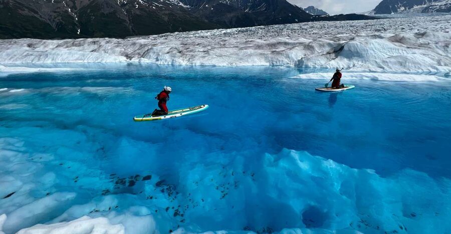 Anchorage: Knik Glacier Helicopter and Paddleboarding Tour - Getting into freezing glacier water