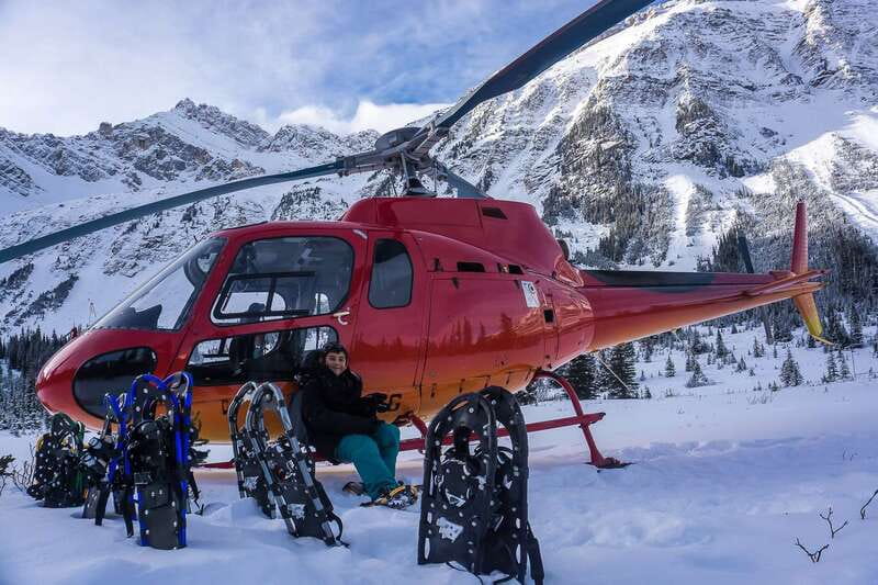 Canadian Rockies: Abraham Lake Ice Bubbles Helicopter Tour - Warming up beside the fire