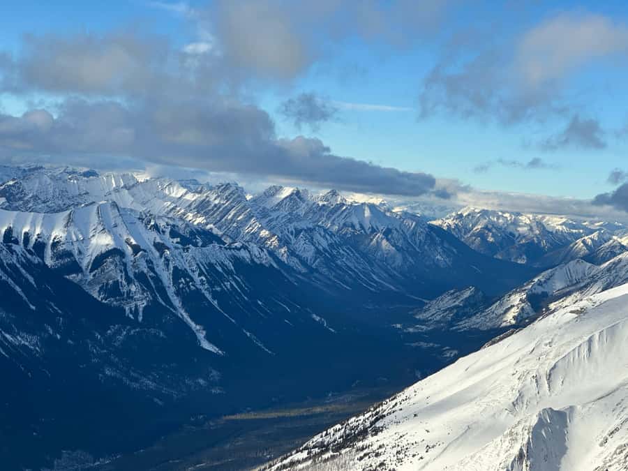 Canmore: 25-Minute Three Sisters Helicopter Tour - Crossing the Bow River toward the Three Sisters