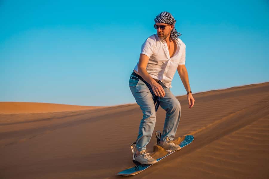 Dubai: Helicopter Ride, Desert Safari, Camels & Refreshments - From Dubai hotel pickup to the Lahbab dunes