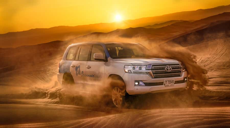 Dubai: Helicopter Ride, Desert Safari, Camels & Refreshments - Dune bashing in a professional 4WD