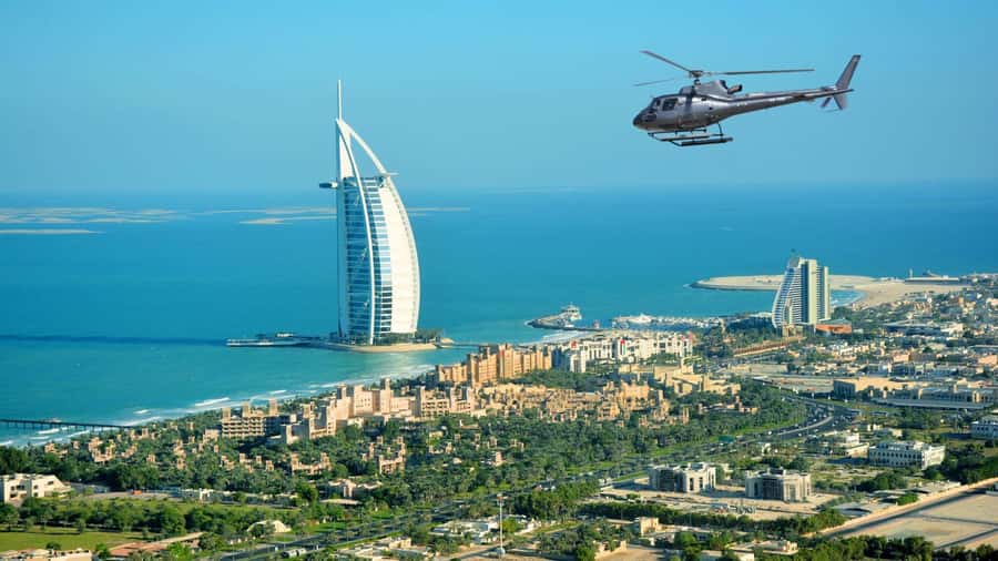 Dubai: Helicopter Ride, Old Town Walking Tour, Abra & Snacks - From the helicopter pad to the Dubai skyline