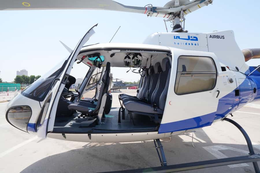 Dubai: Helicopter Ride, Old Town Walking Tour, Abra & Snacks - Al Fahidi’s wind towers and narrow lanes