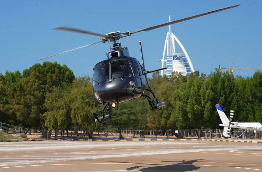 Dubai: Helicopter Ride, Old Town Walking Tour, Abra & Snacks - Crossing Dubai Creek by abra