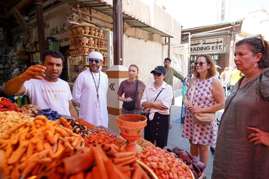 Dubai: Helicopter Ride, Old Town Walking Tour, Abra & Snacks - Why the small-group setup matters