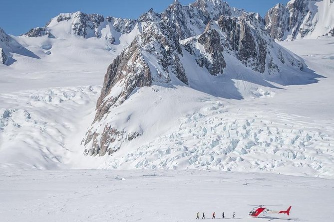 Fox Glacier: 25-Minute Helicopter Flight with Snow Landing - Stepping onto the Fox Glacier Neve