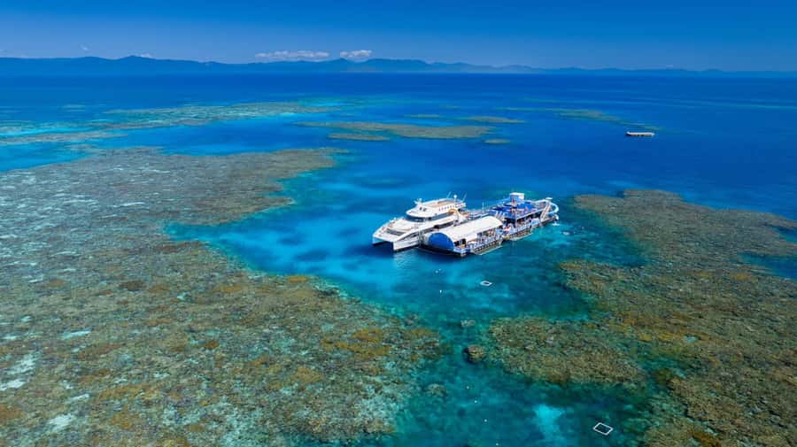 From Cairns: Outer Reef Pontoon, Island & Helicopter Tour - Leaving Cairns Marina for Moore Reef