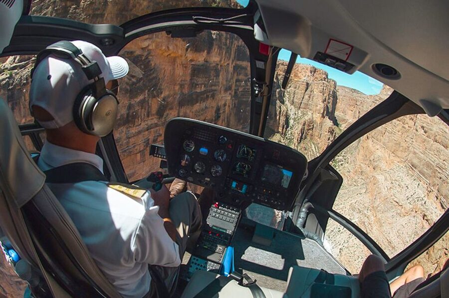Grand Canyon West: West Rim Helicopter Tour with Landing - Descending below the rim to the private landing site