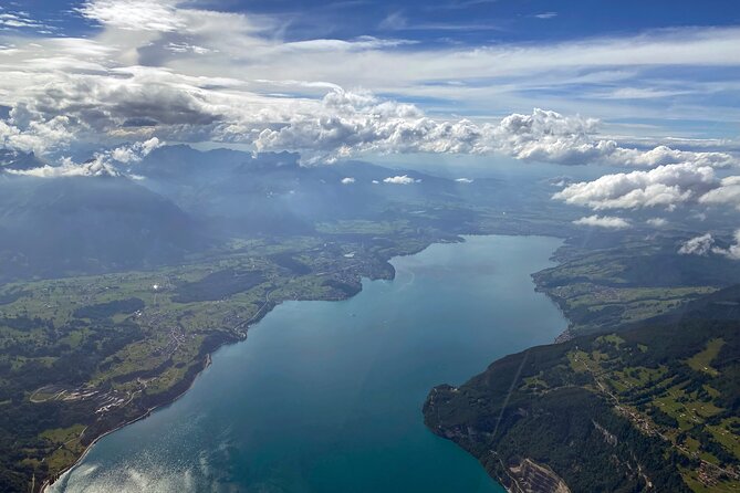 Private helicopter flight to Stockhorn mountain, with view to the Swiss Alps - Passing the Niesen, Switzerland’s pyramid