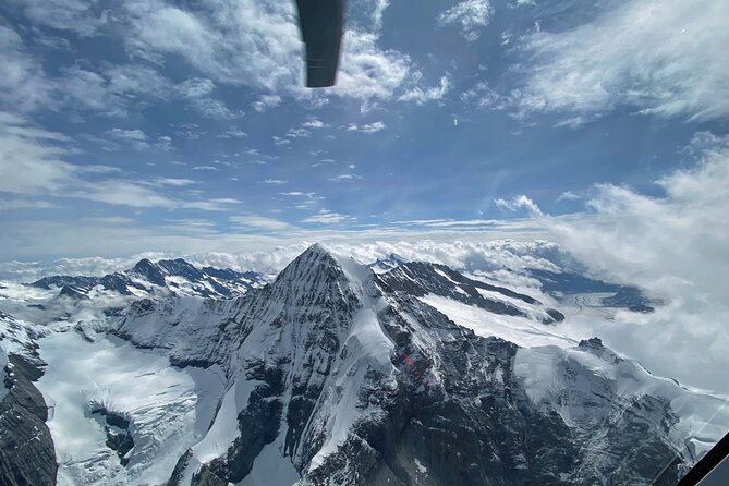 Private helicopter tour to the Swiss Alps - see the Eiger, Monch and Jungfrau - The first views: Bernese Oberland from above