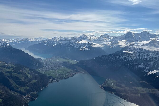Private Swiss Alps helicopter tour over snow covered mountain peaks and glaciers - The Eiger north face and Grindelwald valley