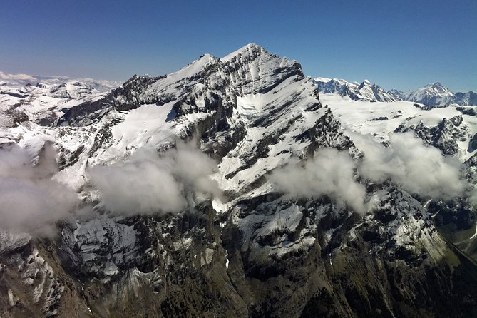 Private Swiss Alps helicopter tour over snow covered mountain peaks and glaciers - Interlaken between two famous lakes