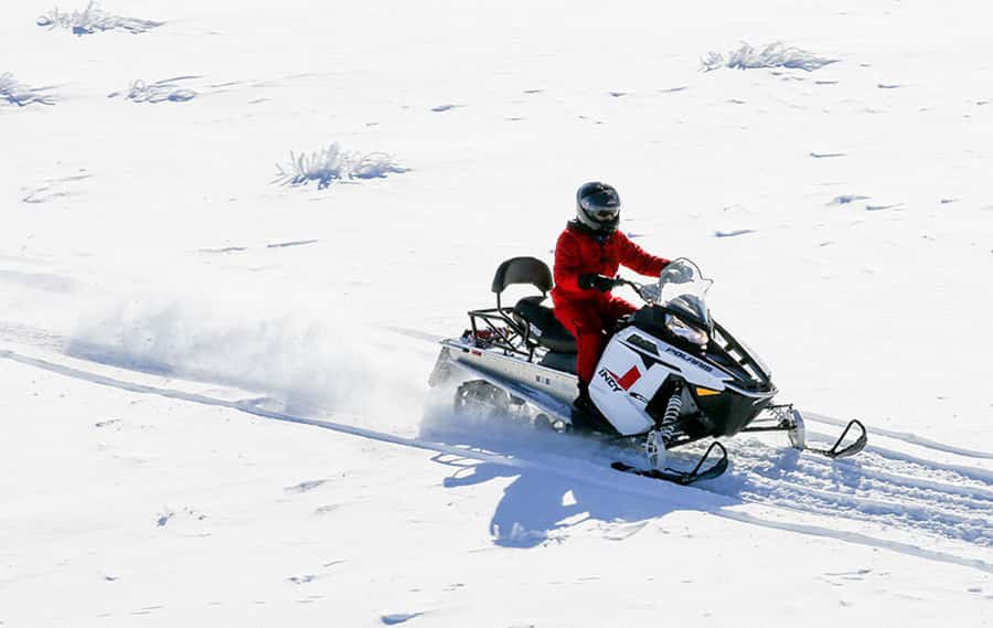 Queenstown: Snowmobiling Experience with Helicopter Flight - Riding the snow across the Garvie Mountain Range