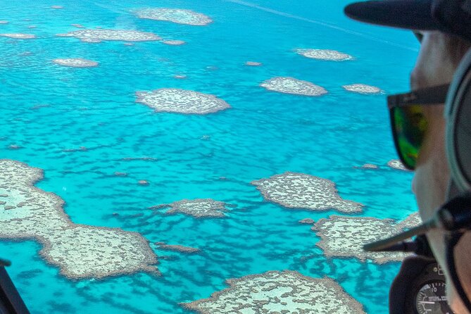 Reef & Whitehaven Spectacular - 60 Minute Helicopter Tour - Leaving Airlie Beach over Shute Harbour