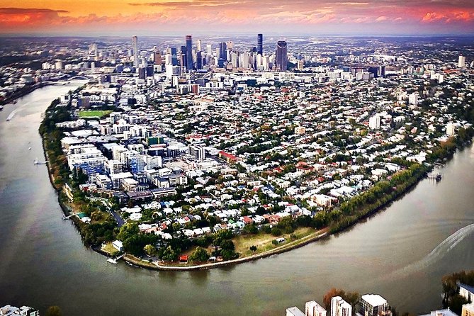 Sunset Private Brisbane CBD + Mt Coot-tha Helicopter Experience - Following the Brisbane River toward the CBD