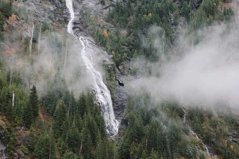 Vancouver: Backcountry Helicopter Tours with Hotel Pickup - Taking photographs from the helicopter